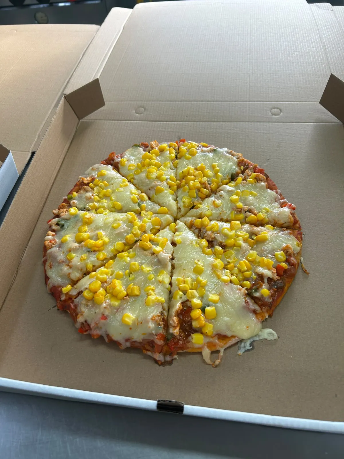 Pizza con choclo y queso